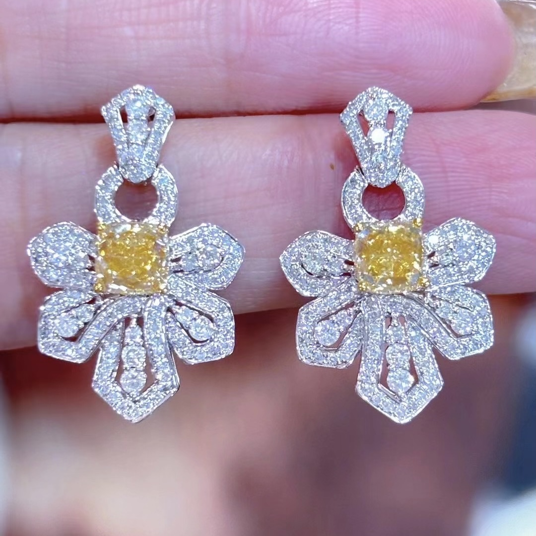2.03 carat main stone yellow diamond earrings in 18K gold